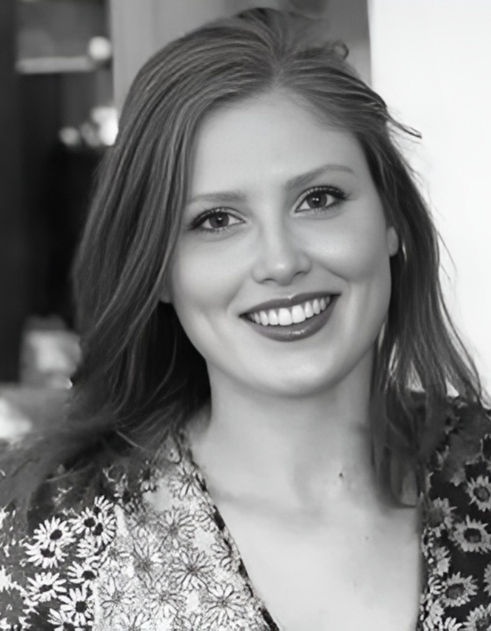 A headshot of Grace, one of the co-founders of Beacons Way Property Management. She is smiling and wearing a floral top.